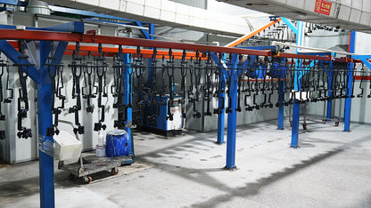 Production line display of multiple baseball bats hanging on racks
