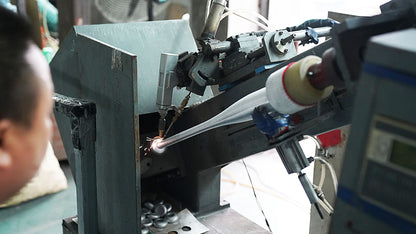 Aluminum baseball bat in a metalworking machine during production