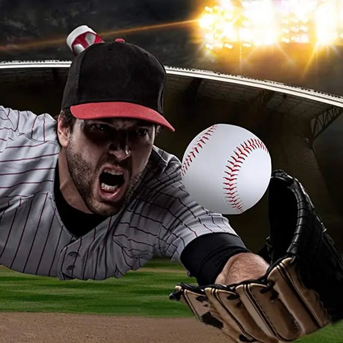 White baseball with red stitching near a glove during batting practice