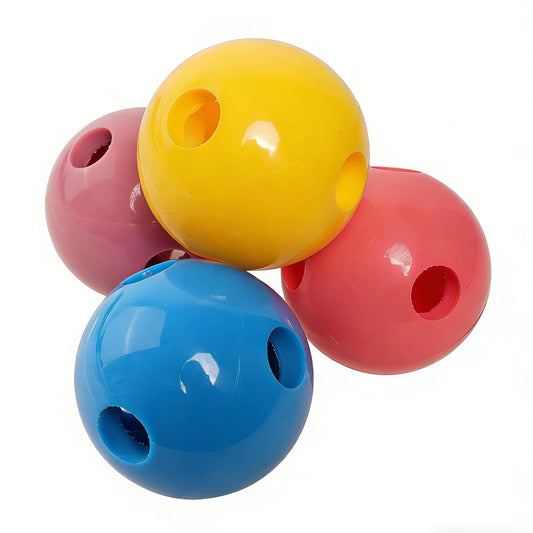 PVC training balls in yellow, blue, and red with side grip holes