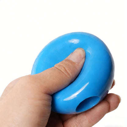 Blue PVC training ball held in hand, with side grip hole