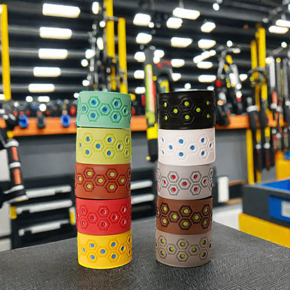 Baseball bat grip tape pair with geometric hex patterns in teal/yellow and black/white