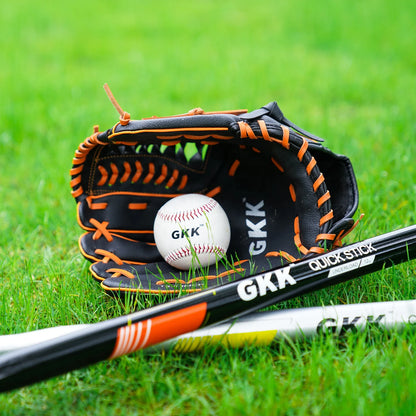 Left-handed infield baseball glove on grass, black leather with orange lacing