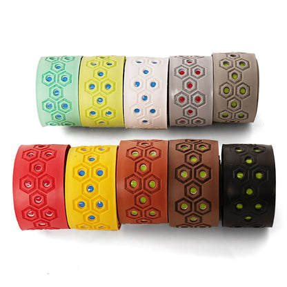 Assorted baseball bat grip tape rolls with hexagon patterns in red, yellow, brown and black
